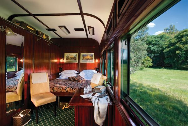 Elegant interior cabin onboard Rovos Rail featuring luxury furnishings and classic vintage design.